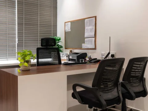 Office desk and chairs in a furnished room